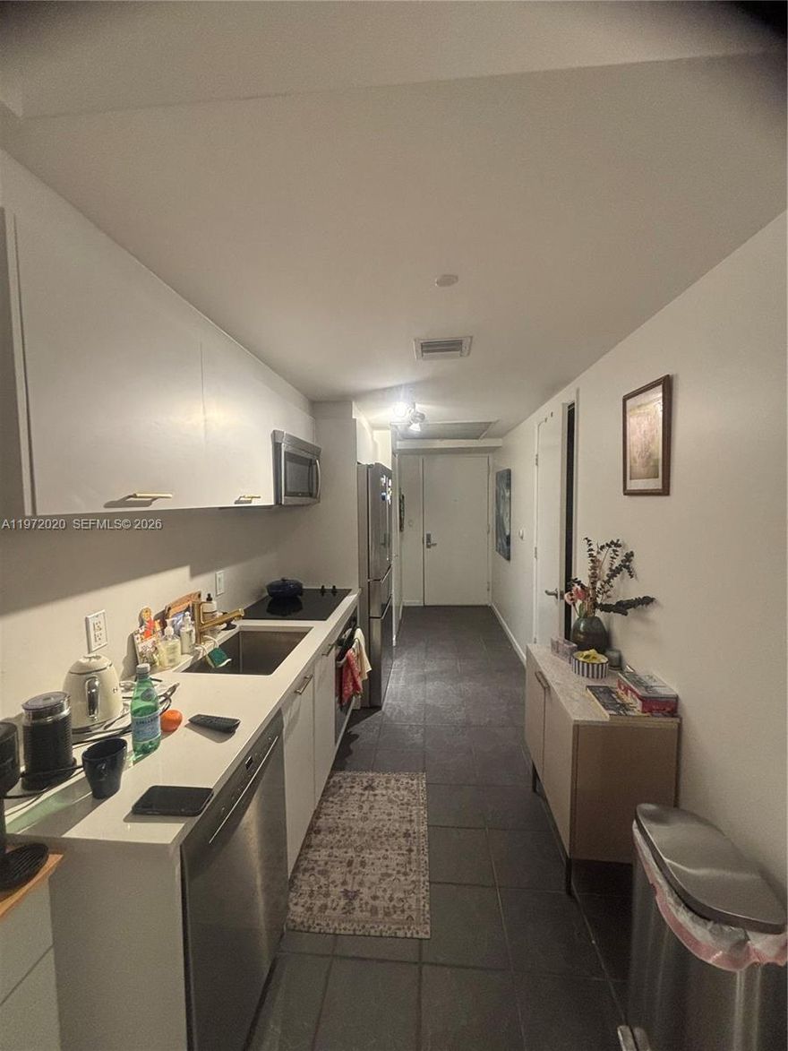 Spacious studio with updates and gorgeous West sunset views. New wood look alike tiles in a light gray. With kitchen cabinets with a light stone counter top. All Bosch appliances, new dishwasher and refrigerator, as well as new stackable washer and dryer. Live in the center of DOWNTOWN MIAMI, a skip away from the Beach cswy, I-95, Brickell, Edgewater and the Performing Arts center. Downtown is evolving everyday. Surrounded by the Waldorf Astoria, the Aston Martin, and the Miami World Center, it is a solid investment. Great financial standing for the building, NO ASSESSMENTS. Spacious studio with updates and gorgeous West sunset views, and new flooring.