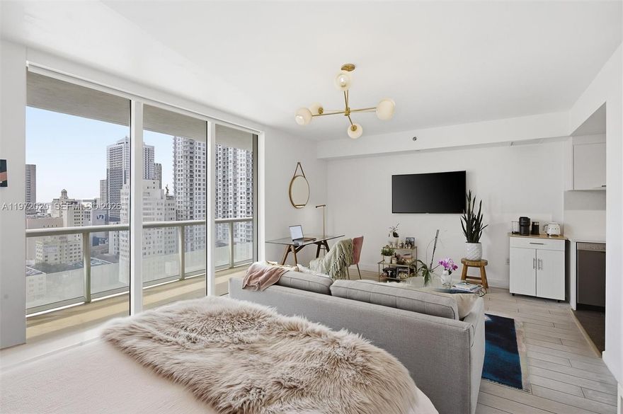 Spacious studio with updates and gorgeous West sunset views. New wood look alike tiles in a light gray, and white kitchen cabinets with a light stone counter top. All Bosch appliances, NEW dishwasher and refrigerator, as well as NEW stackable washer and dryer. Live in the center of DOWNTOWN MIAMI, a skip away from the Beach cswy, I-95, Brickell, Edgewater and the Performing Arts center. Downtown is evolving everyday. Surrounded by the Waldorf Astoria, the Aston Martin, and the Miami World Center, it is a solid investment. Great financial standing for the building, NO ASSESSMENTS.