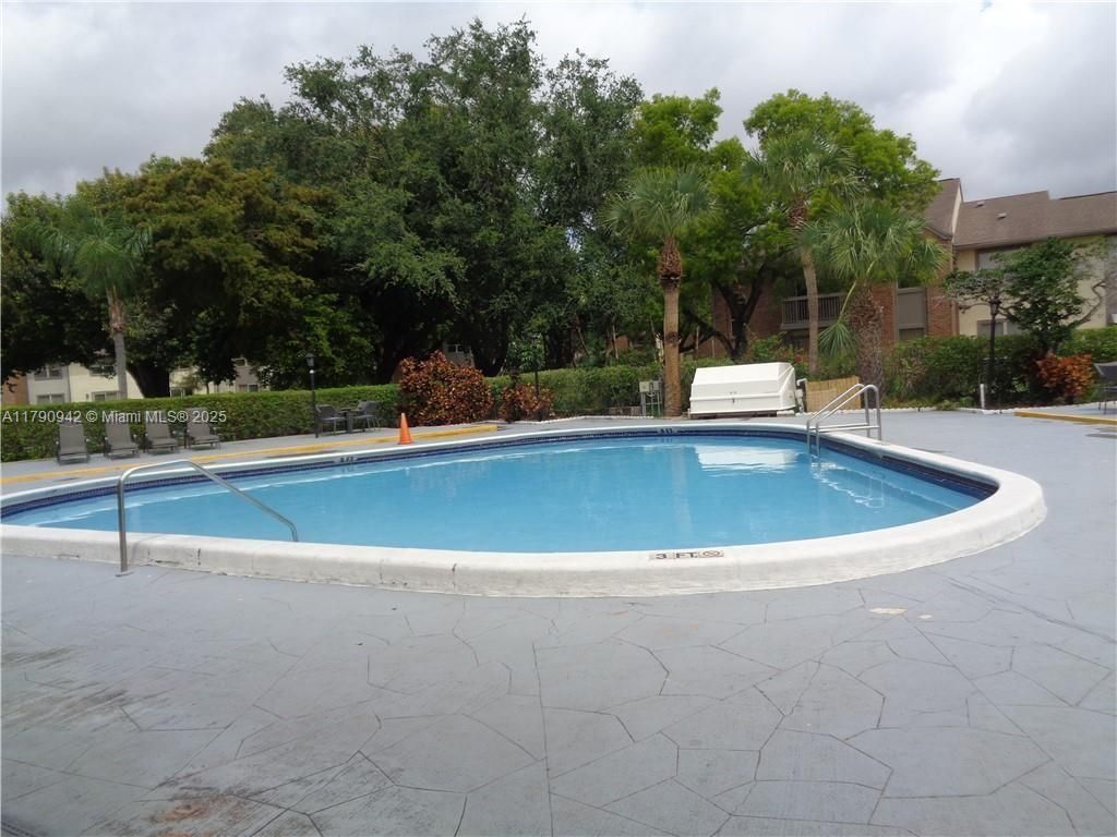 Photo of 4334 NW 9th Ave #7-2F, Deerfield Beach, FL 33064 (MLS # A11790942)