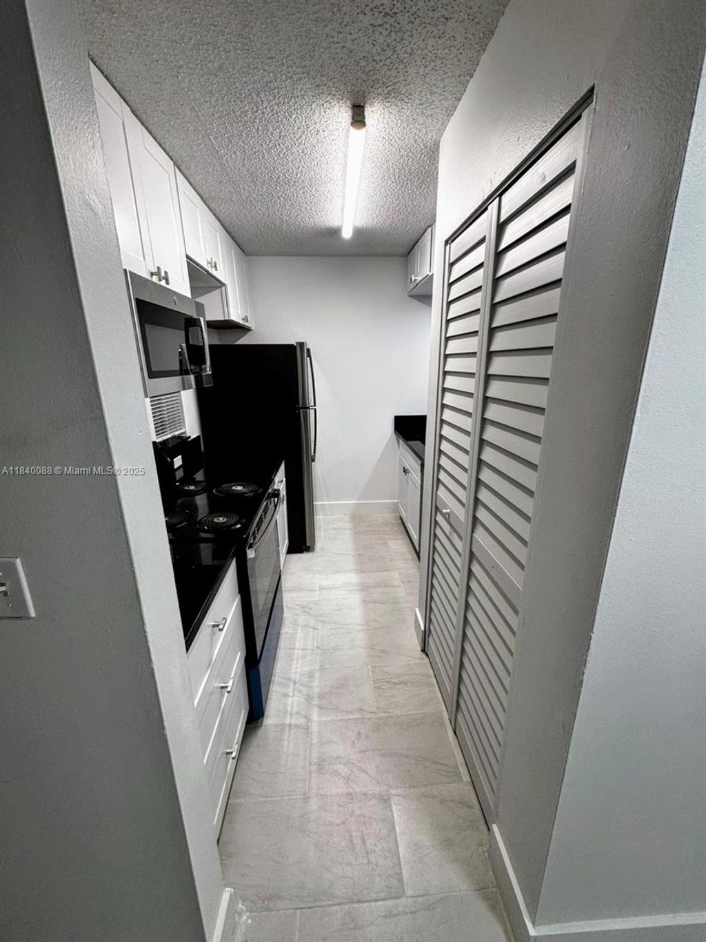 Photo of 9927 Twin Lakes Dr #9927, Coral Springs, FL 33071 (MLS # A11840088)