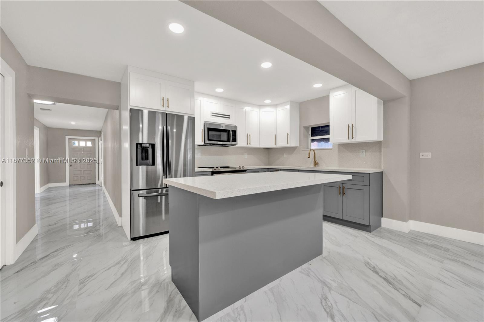 This beautiful 3 bedroom, 2 bathroom house is located in a quiet and family-friendly neighborhood. It has been completely remodeled with high-quality finishes: large format ceramic tile flooring throughout, the kitchen features a two-tone color scheme with quartz countertops, stainless steel appliances, and a breakfast bar. The bathrooms have been remodeled with modern vanities and frameless glass showers. New central air conditioning and heating. Basic utilities are included in the rent and comes with two dedicated parking spaces. Laundry hook ups to bring your own washer/dryer. Available October 1, 2025. Schedule your appointment TODAY!