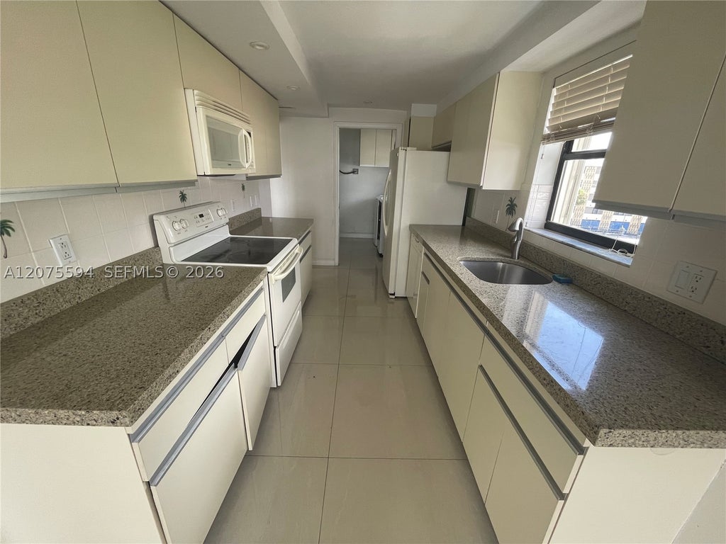 Photo of 200 Golden Isles Dr #401, Hallandale Beach, FL 33009 (MLS # A12075594)