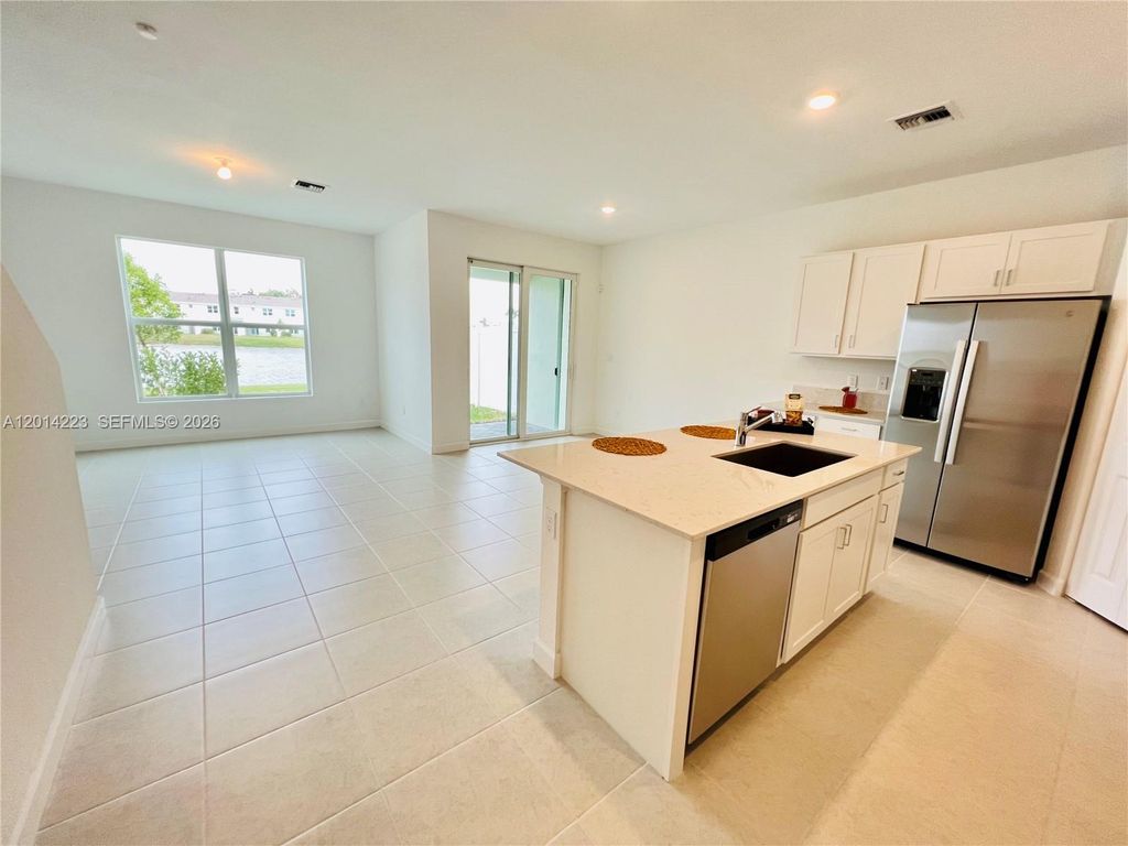 Photo of 6923 Harbours Edge Ave, Lake Worth, FL 33467 (MLS # A12014223)
