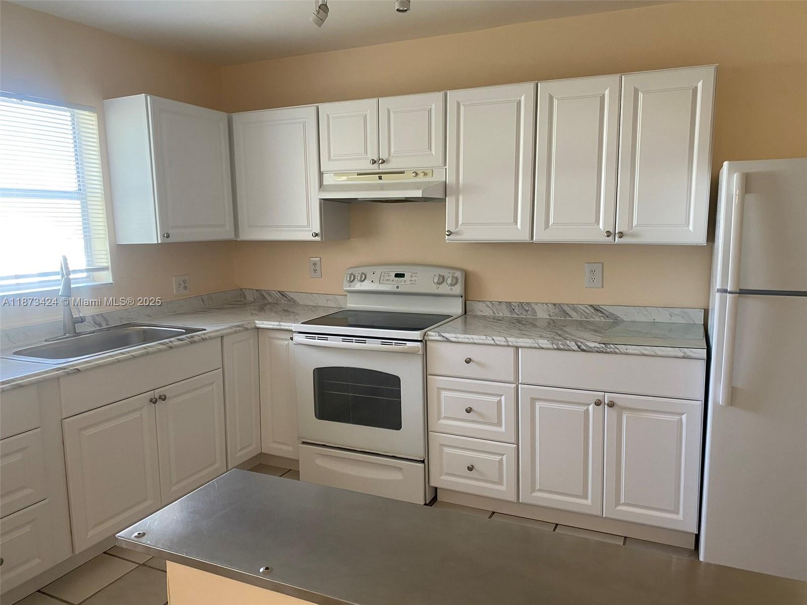 Best and largest line of the building! WATER VIEWS. Beautifully renovated condo in Coral Springs. Tiled throughout and freshly painted. Newer kitchen. 2 bedrooms/ 2 bathrooms. 1,080 sq ft. Unit is located on the third floor (accessible by elevator or stairs). Corner unit. Beautiful screened balcony with lake view. Laundry room on each floor. Many amenities available in this community, such as a pool and a children playground. Very quiet community. Water included in the fees. Assigned parking spot. Can be leased asap.