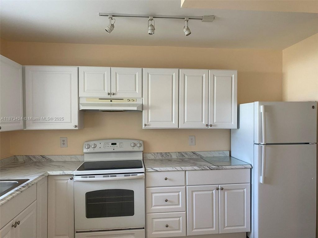 Photo of 10772 La Placida Dr #7-301, Coral Springs, FL 33065 (MLS # A11873424)