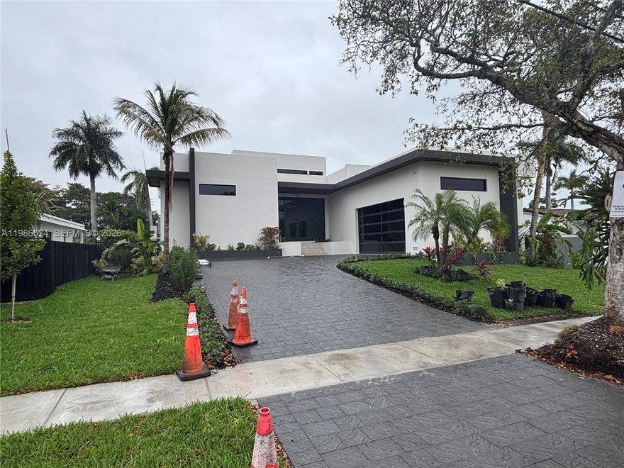 Miami Modern New Construction. Here is the opportunity to move into a brand new modern single level 5 bed, 5.5 bath, 2 car garage home. Features soaring 18' ceilings surrounded by windows on all sides in the Living and Family Room. All bedrooms are ensuite with 12' ceilings. Imported 4' x 4' porcelain tiles throughout the home. The custom European finished Kitchen is a chef's delight with natural gas 48' Wolf stove/ oven and 48" Subzero refrigerator. To entertain we also have a full wet bar and beverage/wine refrigerator. The covered patio terrace includes a built-in natural gas grill, refrigerator and sink for alfresco cooking and entertaining. The patio terrace overlooks the tropical pool surrounded by landscape. See attached photos of the home in its completion stage.