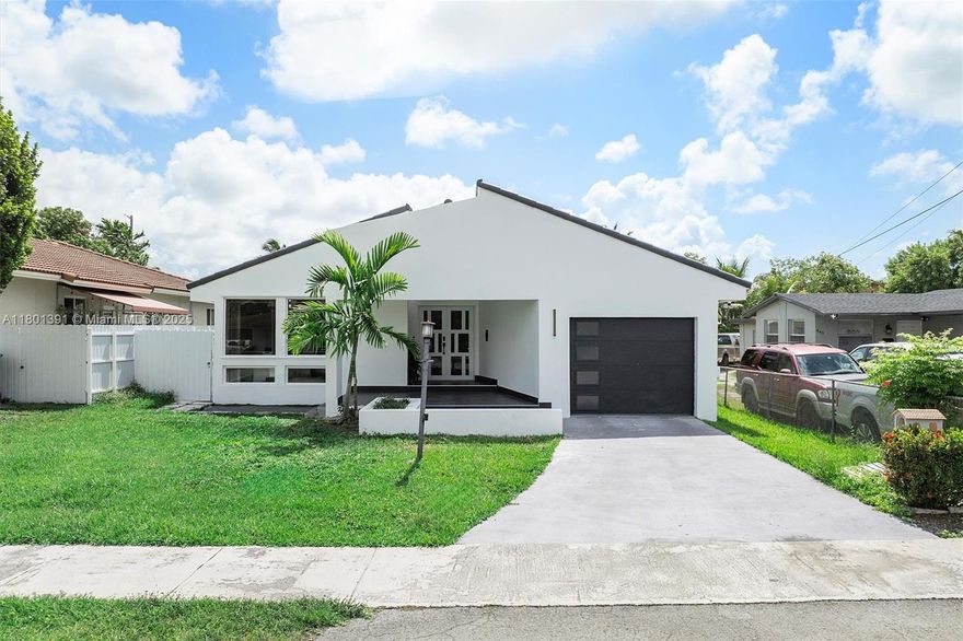 Experience modern elegance in this uniquely designed, fully renovated 3BR + den, 3BA home in Central Miami. Drenched in natural light, the open-concept living area enjoys vaulted ceilings & skylights, while the split office & stacked bedroom plan offer both privacy & function. The luxurious primary suite boasts his-and-hers closets & a spacious bath with dual sinks, tub & walk-in shower. Enjoy the stylish outdoor covered lounge with fire pit—perfect for sipping coffee or wine. The sleek kitchen shines with quartz waterfall countertops, stainless steel appliances & generous storage. Upgrades incl: new flooring, plumbing, electric, impact windows/doors, ductwork & more. One-car garage & fully fenced yard with pool potential. Zoned duplex; minutes from FIU, Coral Gables, Mia Int'l & Stadium.