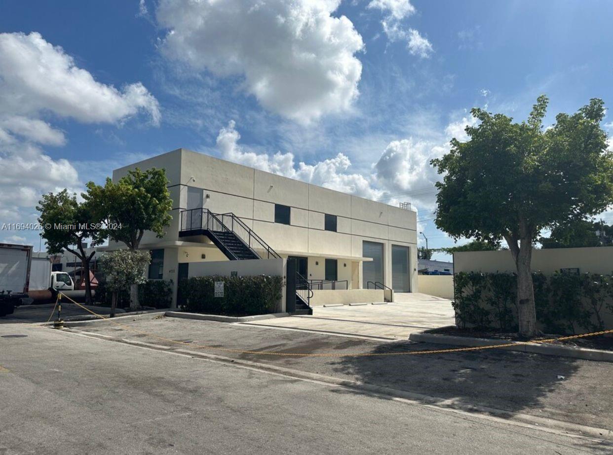 This commercial property boasts a total lot size of 5,708 square feet. It features a flexible 2,176 square foot area, which includes 1,259 square feet of indoor space and 917 square feet of warehouse space, all with a 24-foot clear ceiling height. The recently renovated second floor offers an additional 1,259 square feet of usable space. Furthermore, there is a clear area of 5,500 square feet available for storage or parking. Key amenities include a security camera system, an automatic garage door, and a functional kitchen area. The property was built in 2016.