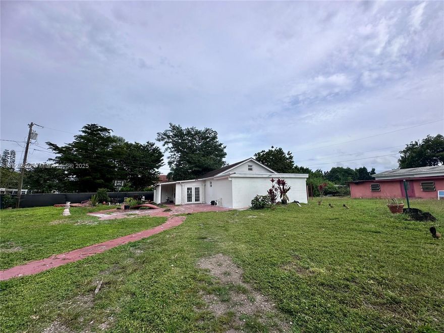 This quiet 2 bed/2 bath gated acre mini farm blends cozy charm with modern upgrades—highlighted by a beautifully remodeled master bath offering a stand-alone tub, stylish design, and a contemporary walk-in shower. The interior is move-in ready, while the exterior offers endless potential for gardens, animals, or custom outdoor living. A versatile third room can function as a bedroom, studio, or income-producing space. 45 min to Key Largo, 1 hour to Miami, you are secluded enough to see the stars every night and hear nothing but the sound of the wind and trees, yet a short drive to Homestead shops, restaurants and entertainment. Full of character and possibility, this property is waiting for new owners (and their pets!) to bring their vision to life. NO HOA, vacant and easy to show! More pictures coming soon! Property recently appraised