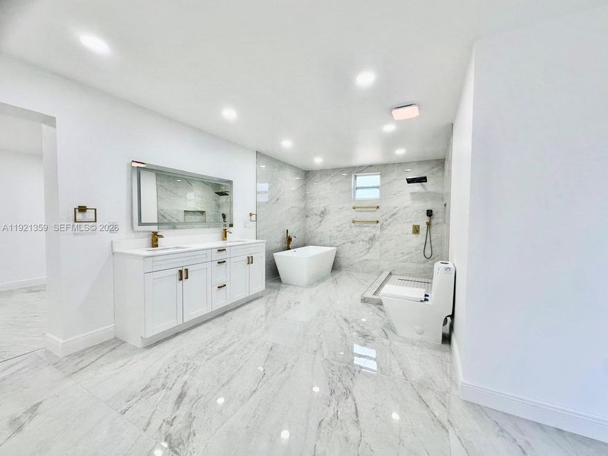 Quiet 2/2 on gated 1-acre mini farm w/ extra room easily convertible to 3rd bedroom or office. Move-in ready w/ remodeled primary bath featuring soaking tub & walk-in shower. Endless outdoor potential for gardens, animals or entertaining. No HOA. Vacant & easy to show. Priced below recent appraisal. Seller open to all offers & credits. Located in Unincorporated dade.