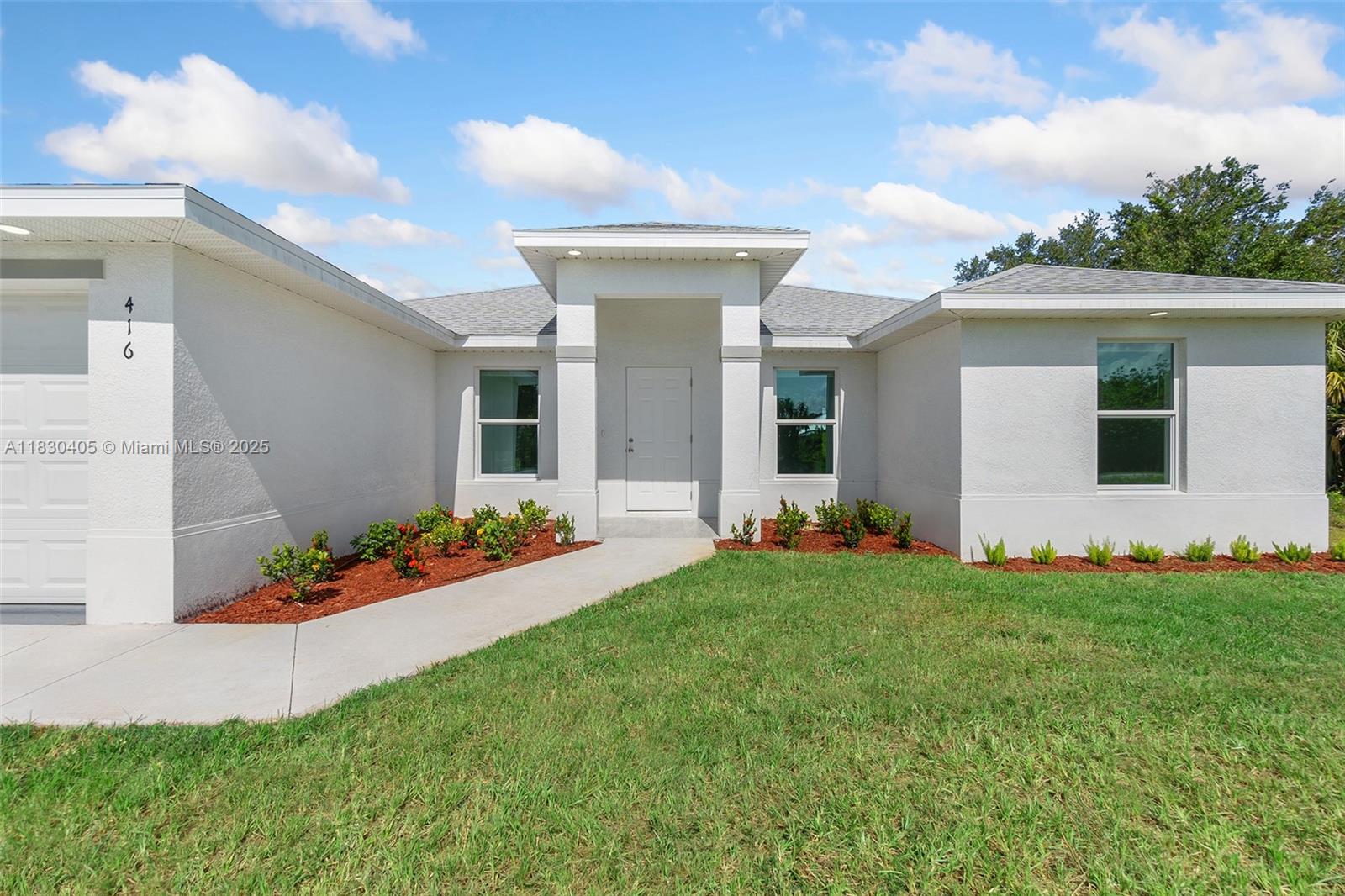 Move-In Ready with Potential Seller Incentives Discover modern living in this newly built home in Lehigh Acres—fully completed and move-in ready. This 3-bedroom, 2-bathroom residence sits on an oversized 10,280 SqFt lot and features all appliances, washer and dryer, built-in closet systems, and a full sprinkler system. Inside, you’ll find durable 24x24 grey tile flooring, quartz countertops with a waterfall island, soft-close shaker cabinets, and stainless steel appliances. The primary suite offers dual vanities, a walk-in shower, and generous closet space. Conveniently located near FGCU, SWFL Airport, and Top Golf. Contact us today to schedule a showing and learn more about possible seller contributions toward closing costs, subject to terms and conditions.