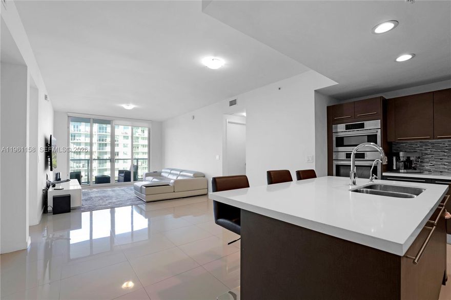 Features 2Bd | 2BA + DEN moder Condo featuring a bright, open-concept layout designed for comfort and entertainig. Specious living area offers floor-to-celling sliding glass doors that flood the space with natural light and open to private bancony with plaza view. Contemporary finished included, modern cabinetry, receddded lighting ideal for hosting and everday living, porcelain tile floors, impact windows, in-unit washer/dryer, european kitchen with quartz countertops, Bosch appliances, and smart home features.  Enjoy worry-free living.  HOA inclided high-speed internet, water, shash romoval, TV cable service, clubhouse with fully equiped gym, pool and spa, and two assigsed parking space.