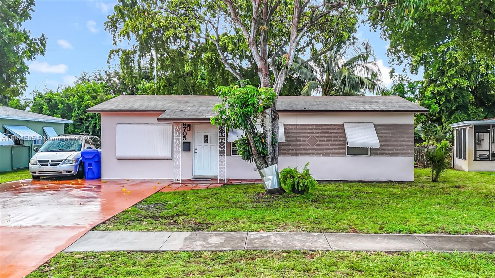 This Beautiful and Clean 3/1 Home is located in a nice and quiet area of Hollywood. The home has been freshly painted and new Hurricane Proof Windows and Doors have been ordered and will be installed in 2 months. The property showcases a spacious backyard to enjoy BBQ's and host family and friends. Enjoy mangoes from the Mango Tree located in your front yard. Third bedroom has a new wall Split System AC. Separate Laundry Room with newer full size Washer and Dryer. Gas Water Heater makes you save on your electric bill !! Driveway for 4 cars !! Minutes to Shopping Centers, Parks, Schools, Restaurants and 20 minutes to Hollywood Beach. Easy to show !!