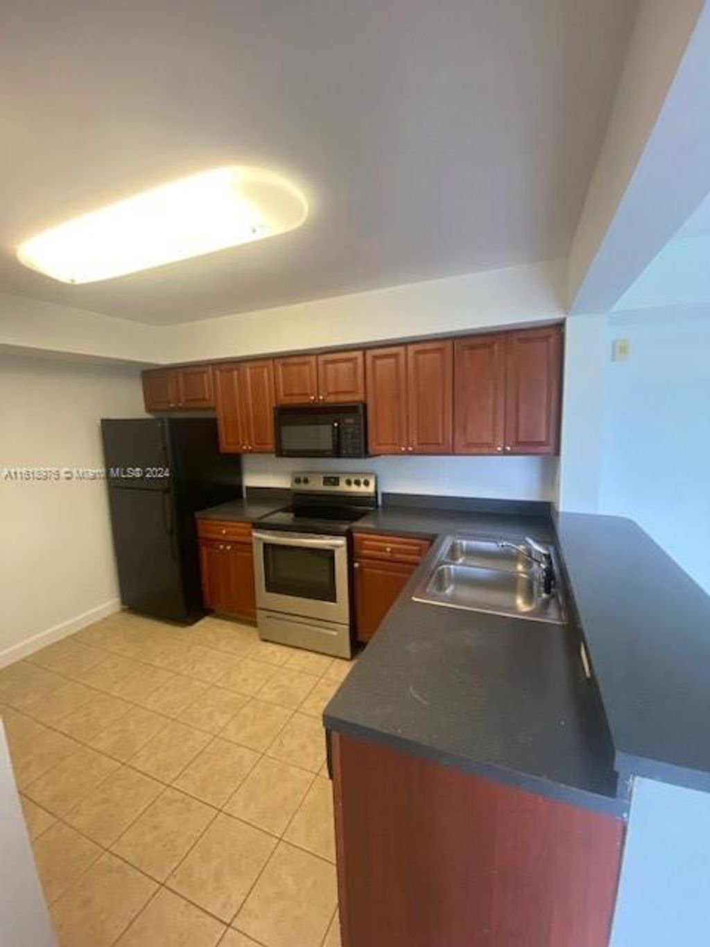 Photo of 10115 W Sunrise Blvd #202, Plantation, FL 33322 (MLS # A11618976)