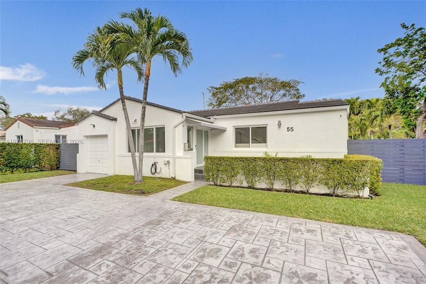Nestled in the highly desirable Miami Shores, this updated home sits on a tree-lined street and boasts a spacious lot with an inviting outdoor area, ideal for entertaining. Thoughtfully upgraded in 2020, the property features a new roof, electrical panel, hurricane impact windows and doors, irrigation system, and a circular driveway. The redesigned kitchen and fully renovated bathrooms reflect modern style and functionality. The flexible floorplan includes a versatile room currently used as a dining area, easily convertible into a third bedroom. The garage has been transformed into a climate-controlled gym with a brand-new split AC unit, offering additional lifestyle space. Every detail has been carefully considered for comfort, style, and modern living.