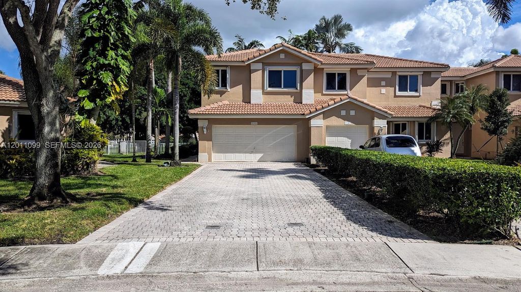 Photo of 1181 SW 158th Ave #1181, Pembroke Pines, FL 33027 (MLS # A12011099)