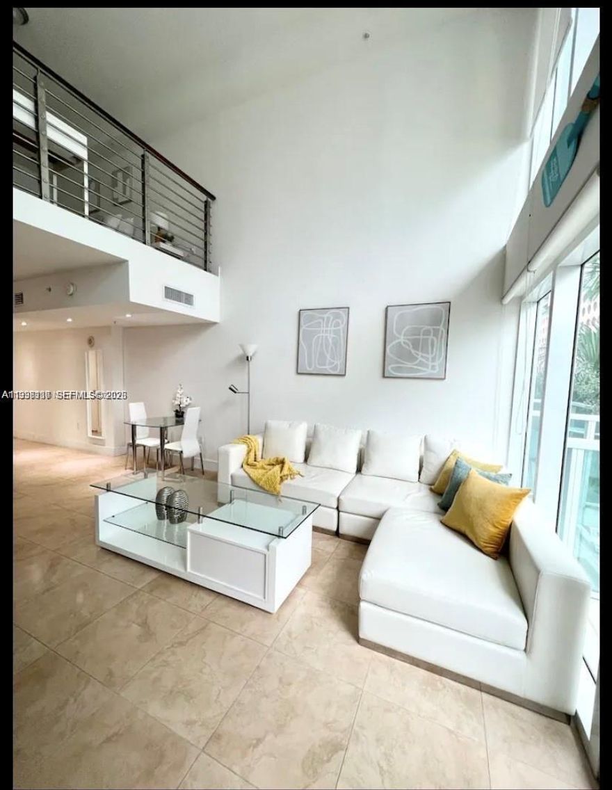 Experience urban luxury in this spectacular bi-level loft in the vibrant heart of Brickell. This 1-bedroom, 2-bathroom residence features soaring floor-to-ceiling impact windows with stunning city views. The modern European-style kitchen is equipped with granite countertops and stainless steel appliances, complemented by elegant marble floors throughout. For ultimate convenience, the washer/dryer is located within the primary suite on the second level.

Enjoy resort-style amenities including two pools, a 24/7 fitness center, concierge, and valet parking. Located steps from the 5th St Metromover, Brickell City Centre, and Mary Brickell Village, you are walking distance to elite dining, shopping, and nightlife. The unit comes fully furnished with one covered parking space. Fast HOA approval.