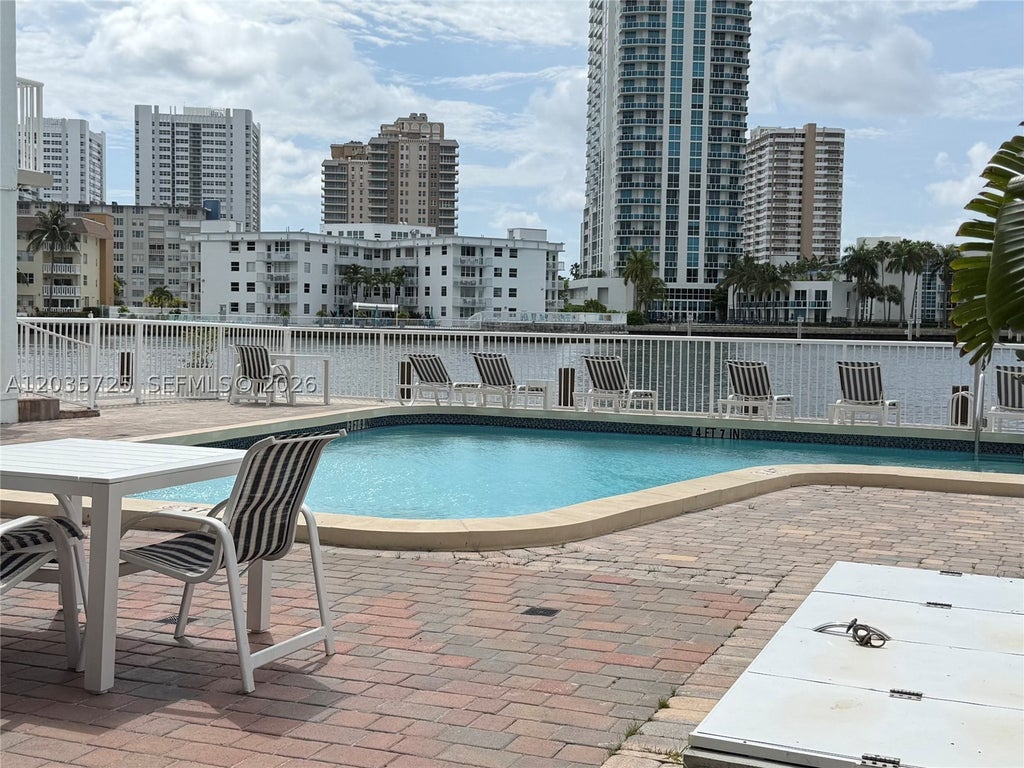 Photo of 121 Golden Isles Dr #904, Hallandale Beach, FL 33009 (MLS # A12035725)