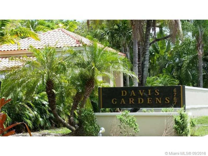 GATED COMMUNITY in South Miami, the EXCLUSIVE Davis Gardens! Home features: soaring ceilings in these 2 story home. Kitchen and bathrooms are updated. 3 Beds and 3 Baths. 1 Bed and 1 Bath is on the first floor. Wonderful floor plan! Huge Master bedroom has a terrace with a large walking closet! Family room and kitchen are overlooking the beautiful garden and there is plenty of natural light in every room! Brand-new Washer and Dryer. Big yard.