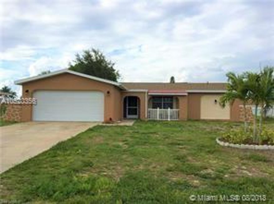 JUST REDUCED & LOOKING FOR A FAMILY.... If you're seeking a lovely well established and mature area of of Cape Coral, this is it! Centrally located in SE Cape Coral, this 3 bedroom 2 bath with a double car garage is a charm... Fenced backyard, tile through out and many other features in this split plan home that will make for a wonderful place to call home... Open area and screened lanai. Central water, Central sewer... No need to worry about future assessments. Come check out this home today! Very Very easy to show, last minutes showings are okay... **Buyer to assume any assessment balance** Check with City of Cape Coral for information.