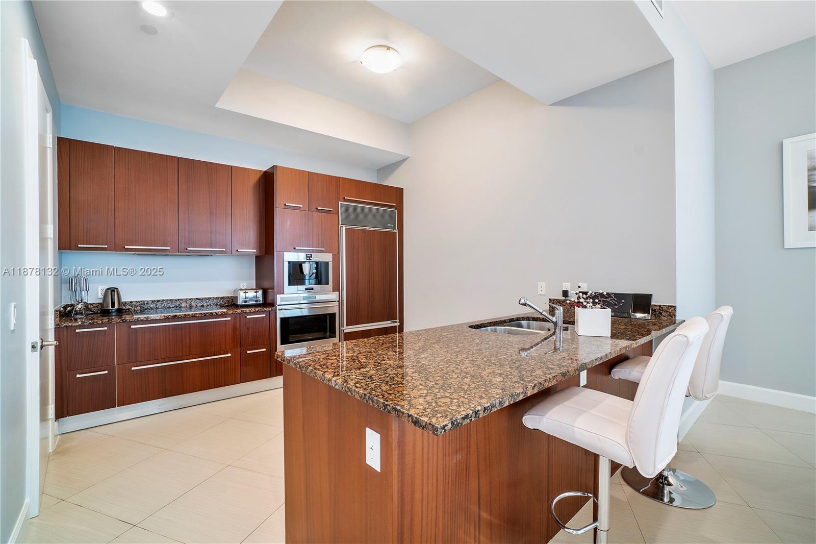 This beautifully furnished residence features 2 bedrooms, an enclosed den and 3 full bathrooms. Enjoy breathtaking ocean and city views from floor-to-ceiling windows and 11-foot ceilings. The open-concept kitchen boasts granite countertops and stainless steel appliances, ideal for modern living and entertaining. Private elevator foyer. Building amenities include: State-of-the-art fitness center, Sauna & heated pool, Clubroom & business center, Beach service with towels & chairs. Ideally located within walking distance to top restaurants and shops. Just minutes from Bal Harbour, Aventura Mall, and major airports.