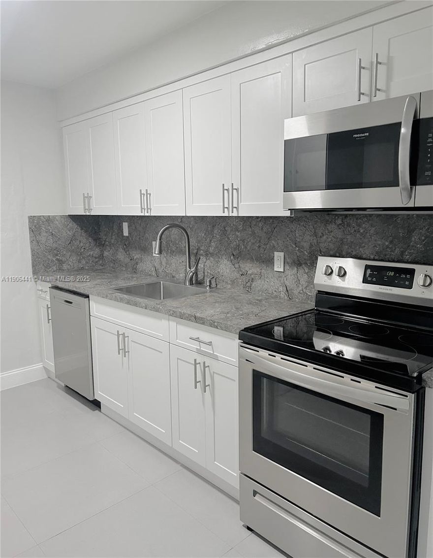 This charming and well maintained 2 bedroom 2 1/2 bathroom home is ready for it's new family! This gem features a renovated kitchen and bathrooms, tile floors throughout and washer and dryer in the unit. It is conveniently located near the beach, shops and fine dining establishments. Water is included in monthly rent.