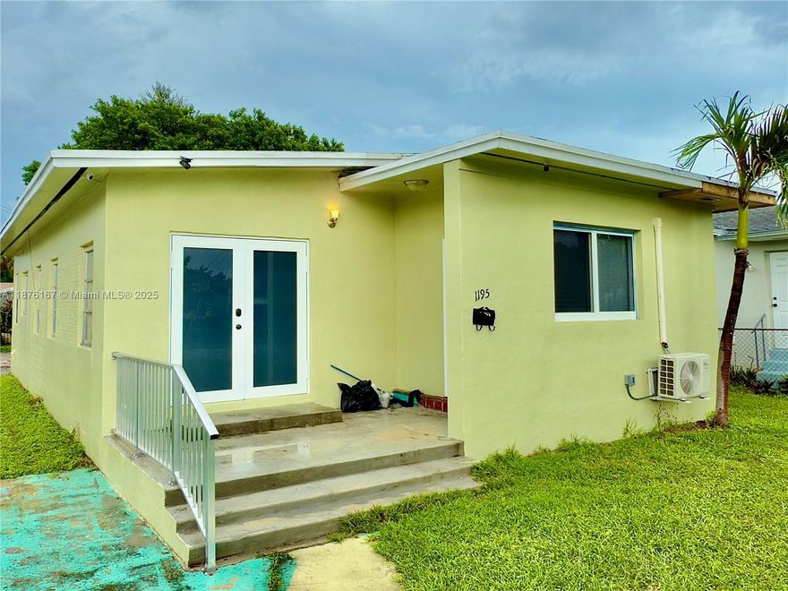 Prime opportunity in Miami! This elevated corner property offers superb value in a highly desirable location. Boasting a brand-new roof, newer flooring throughout, and an independent studio entrance ideal for additional income or guest stays, this home flows beautifully and offers flexibility. Located just 7 minutes from the Design District, you’ll enjoy close access to galleries, dining, art & touristic hotspots. Quiet, yet well connected — minutes to major thoroughfares for easy commute to Midtown, Wynwood, beaches, airport. Raised above street level for enhanced privacy and drainage. This address falls within an Opportunity Zone, ideal for smart investors looking to build equity and income and for families.