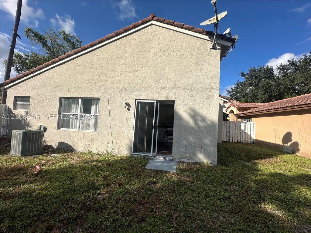 Photo of 1262 NW 126th Ave, Sunrise, FL 33323 (MLS # A12108160)