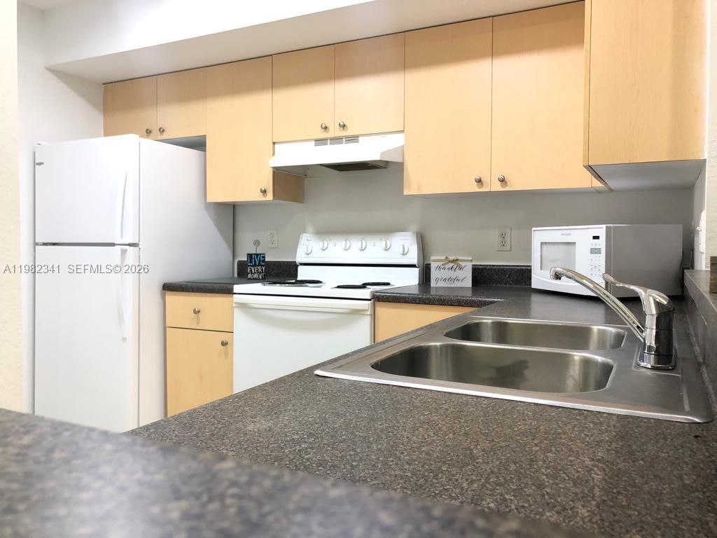 Photo of 2544 Centergate Dr #308, Miramar, FL 33025 (MLS # A11982341)