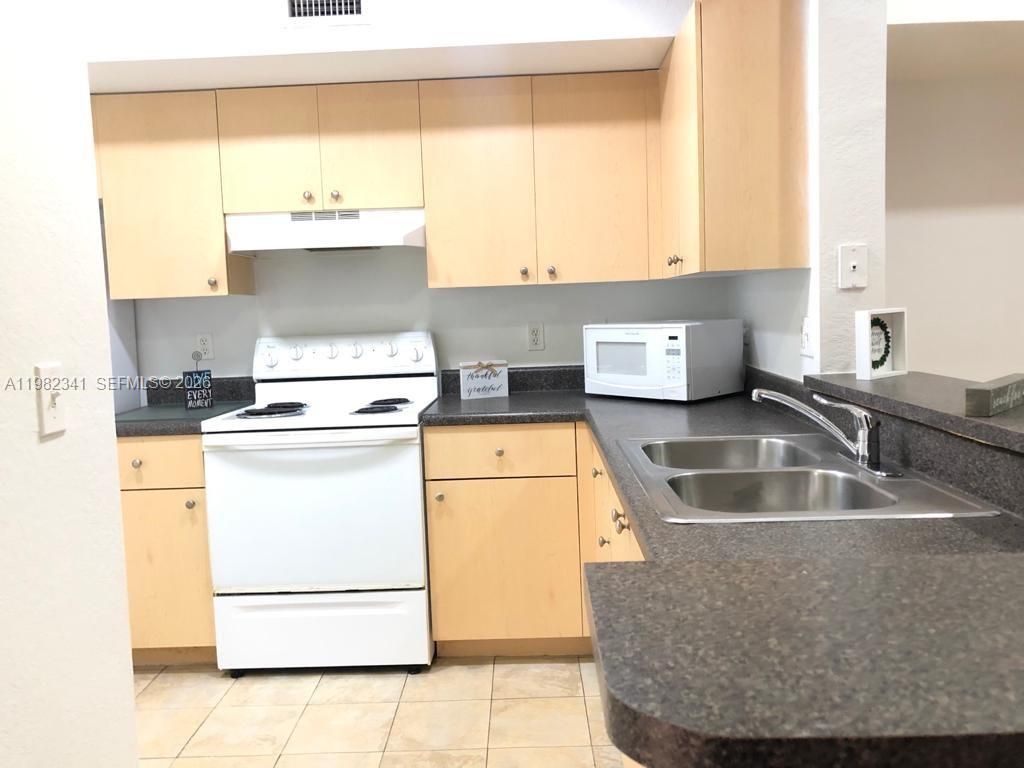 Photo of 2544 Centergate Dr #308, Miramar, FL 33025 (MLS # A11982341)