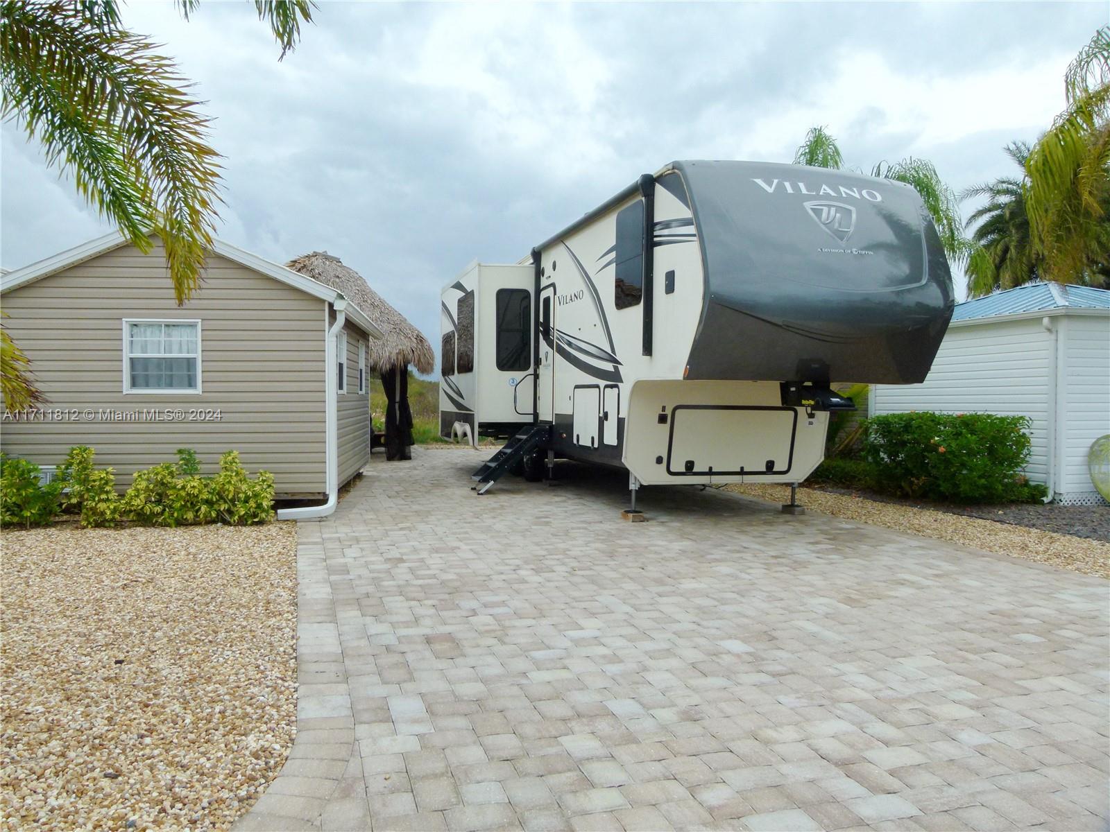 Lovely lot at 90-acre gated community of Silver Palms RV Resort. The clubhouse has daily activities and a full-time activity director. Billiard and card room, library and fitness center. Pickleball courts, dog park, poolside bar and grill. This lot overlooks the nature preserve. Tiki is less than 2 yrs old. Fully deeded lot ownership. Lovely, finished casita with 1/2 bath, AC, washer/dryer, daybed, and kitchen countertop. Tastefully decorated. Call today to own your own piece of paradise!