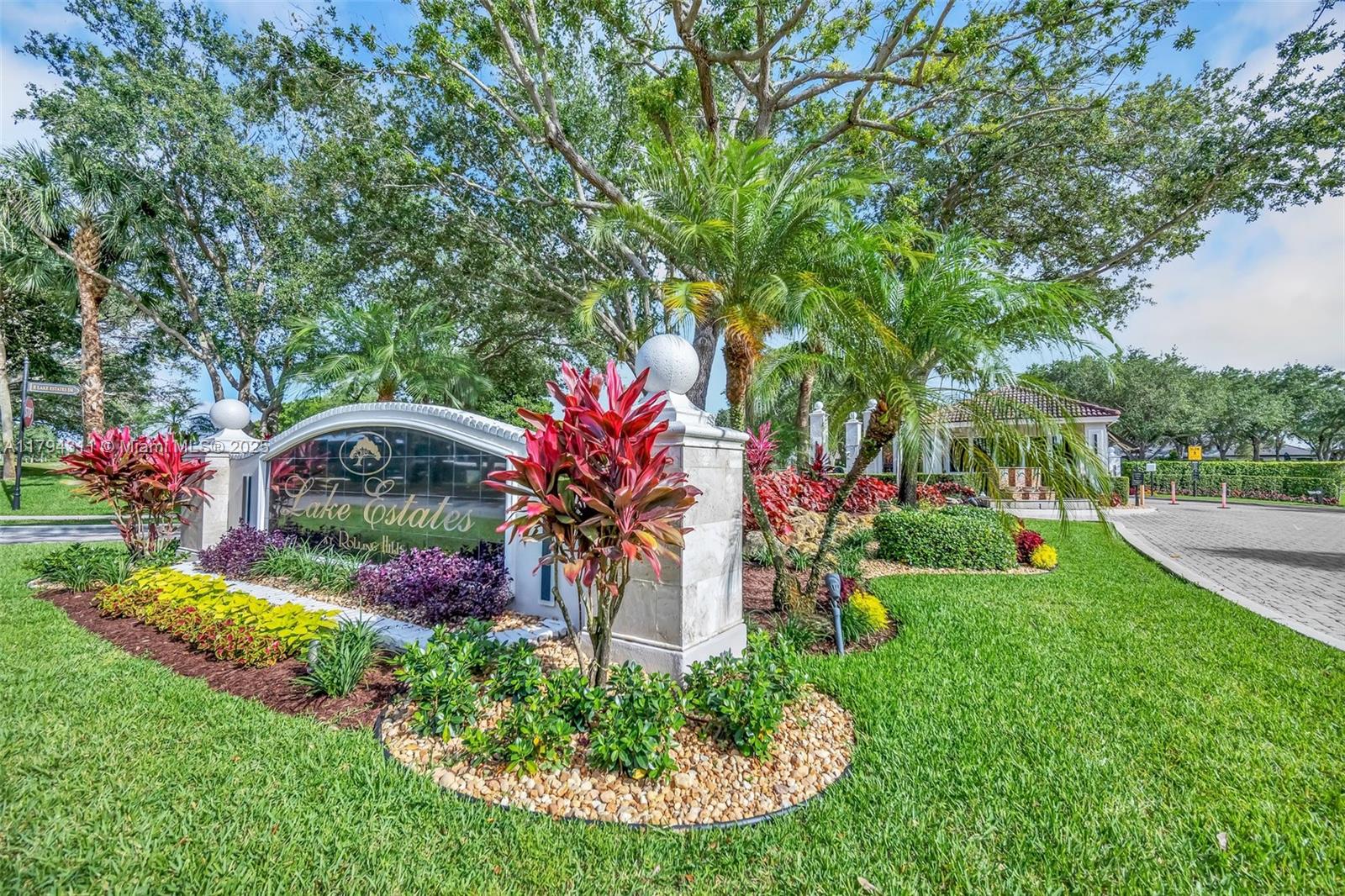 **Live in the exclusive gated community of Rolling Hills Lake Estates. Coming in just under 4,000 sq feet under air, this home boasts 5 BR suites, 4 full baths with the master bedroom suite, plus another bedroom suite or office located on the first floor, plus 3 suites upstairs. Outside, you'll enjoy the gorgeous lanai with a sparkling pool & wraparound patio on a private, lushly landscaped waterfront lot. New Roof, New AC, Accordion shutters/ panels and a 2.5 car garage. Bring your golf cart! This is a customized & expanded RARELY AVAILABLE two-story estate. Only 225 luxury homes in this exclusive gated community. HOA Fees $975/ Qtr. Ideal Davie location... offering a plethora of fine dining & shopping, Davie's "A" Rated Schools, close to all major highways, beaches and Nova University!