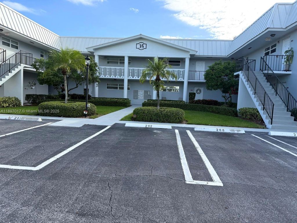 Photo of 35 Colonial Club Dr #203, Boynton Beach, FL 33435 (MLS # A11897017)