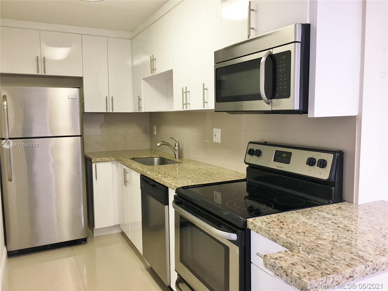 Unit on the top floor. Lovely remodeled 2 BR/ 2 BA unit in Sunset Villas. Split floor plan with en-suite bathrooms. Sleek tiled floors throughout, granite counter tops,stainless steel appliances. Master bedroom with walk-in closet. 1 assigned parking. Great location near Palmetto Expressway, and Miami Int'l Airport. Gated community with security, pools, & children's playground. Laundry rooms in building.