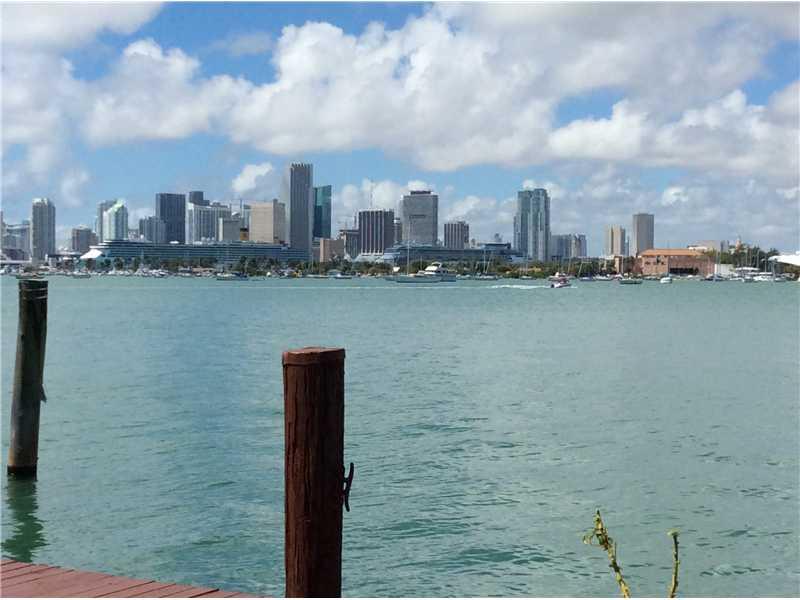 Wide bay waterfront, with stunning downtown and cruise ship views. LAND VALUE ONLY. 60' x 175' lot improved with 1937 house. 10,500 square feet. RS-3 zoning. Existing dock.
