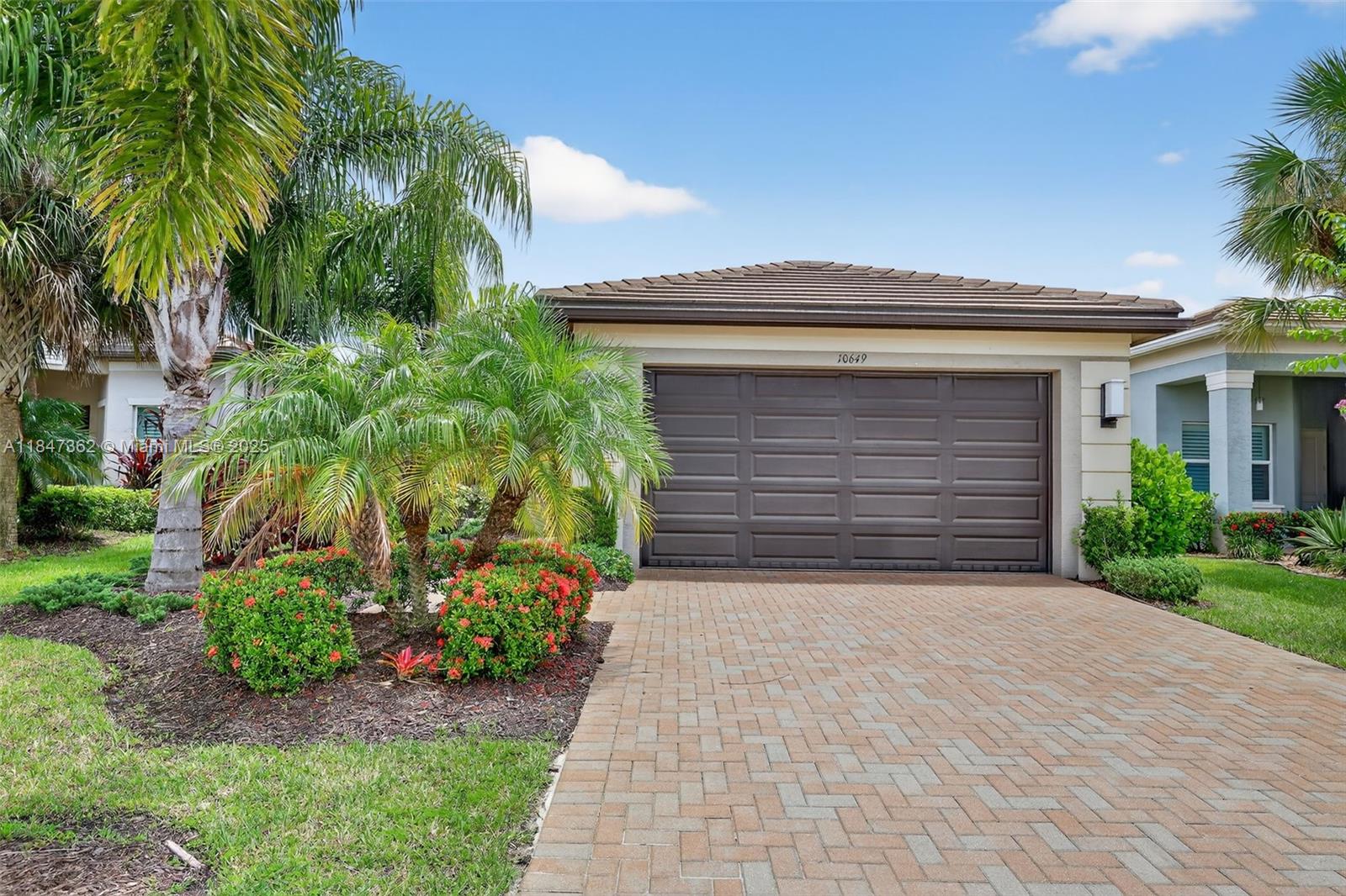 Beautiful and private Lucia model with a berm view, featuring natural gas and a full-house generator for peace of mind. No carpet—upgraded tile flows throughout. Elegant glass entry doors welcome you into this meticulously maintained home. Enjoy your morning coffee in the cozy breakfast room. Kitchen offers slate-finish appliances, granite countertops, designer tile backsplash, built-in pantry with pullouts. Plantation shutters, motorized shades, and custom touches add to the appeal. Relax or entertain on the extended patio with a fully equipped summer kitchen. Tankless water heater for efficiency. This home has it all—comfort, style, and functionality! Don't wait to Enjoy the Riverland Lifestyle!
