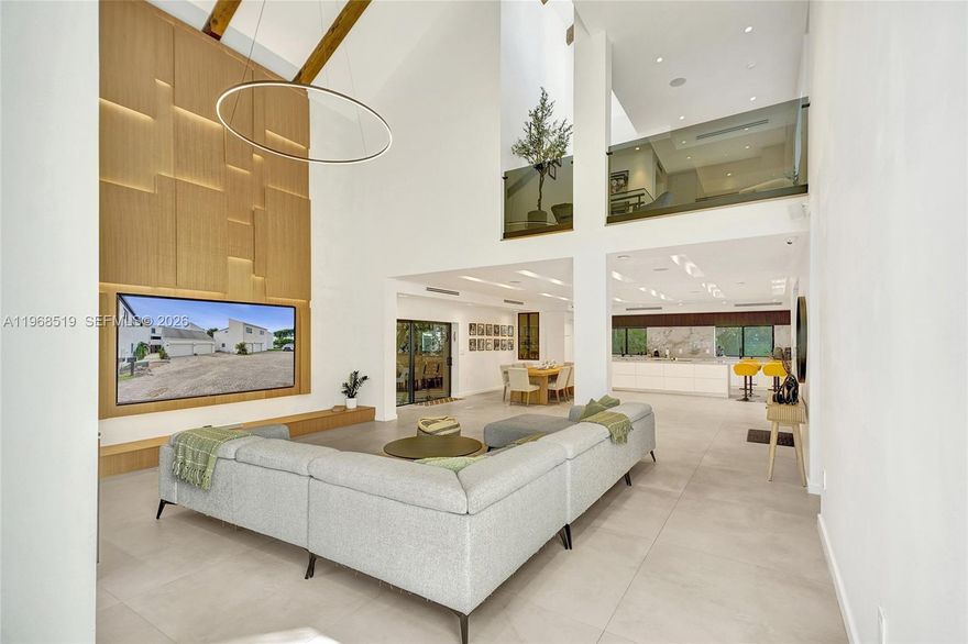 Completely rebuilt , this stunning 6-bedroom, 6.5-bathroom residence offers 4,886 square feet of luxurious living space with every detail thoughtfully upgraded. Everything in the home is 100% new, including the roof (flat and shingle, 2023), insulation, and three A/C units (5, 5, and 3 tons) installed in December 2023.
Designed with modern elegance in mind, the home features impact windows and doors, smart toilets, a fully integrated security system on both floors, security cameras, built-in Bose ceiling speakers throughout (including outdoor areas), and a wall-mounted iPad for smart home control. Kids’ bedrooms include Bluetooth-enabled ceiling fans for music.
The gourmet kitchen showcases quartz countertops, LED-upgraded cabinetry with touch features, and a ductless hood. The open-concept primary suite seamlessly connects to a spa-style bathroom with smokey grey glass shower for added privacy.
Upstairs, you’ll find stackable LG laundry units for convenience. Outdoors, enjoy a 20x20 pergola (2025), a fully equipped outdoor kitchen with BBQ grill, sink, ice machine, and refrigerator, plus new wood fencing and irrigation system. Landscaping is maintained by the community, which also offers a community pool.
Additional highlights include a 2-car garage, driveway parking for two more vehicles, and ample guest parking.