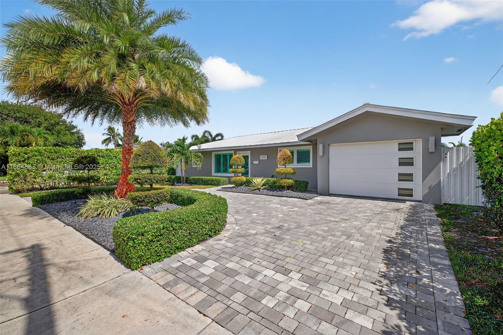 Experience waterfront luxury in this private oasis featuring 65 ft of water frontage with ocean access and no fixed bridges. This completely turnkey residence has an open layout perfect for entertaining family and friends. Kitchen features high-end stainless steel appliances, marble countertops, and a gas stove. Enjoy your own private dock (with water and electric), sparkling pool, and hot tub surrounded by lush landscaping. Italian porcelain tile flows throughout, complementing 3 spacious bedrooms plus a versatile den/office. All impact windows/doors and metal roof. Lawn and pool maintenance are included. Ideally situated just minutes from the shoppes and restaurants on Las Olas and Fort Lauderdale Beach. Minutes from FLL airport, with easy access to I-95, 595, and the Turnpike.