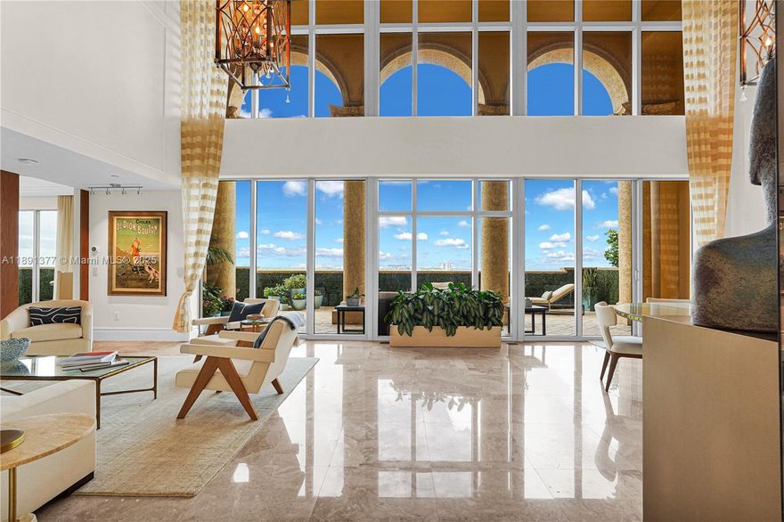 Welcome to Penthouse 7 at Villas of Positano, a stunning two-story oceanfront residence in the heart of Hollywood Beach. This fully furnished designer home offers 3,683 sq. ft., 3 bedrooms + den | 3.5 bathrooms, soaring 21-ft ceilings, a private elevator, and a 797 sq. ft. terrace showcasing breathtaking ocean, bay, city, and park views. Features include marble floors, a remodeled Italian gourmet kitchen, a grand living room, a primary suite on the main level, and an entertainment mezzanine. Enjoy resort-style amenities: oceanfront pool, spa, fitness center, concierge, valet, and direct beach & marina access—the perfect blend of privacy, sophistication, and coastal luxury.