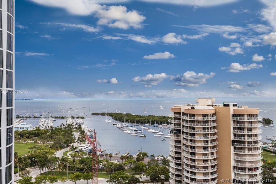 The stunning 3- bedroom, 2.5-bathroom corner unit offers views of Biscayne Bay and the Coconut Grove marina. The brand new residence showcases a spacious floor plan which extends to oversized balconies with vertical floor-to-ceiling windows. A tremendous chef’s kitchen offers Sub-Zero and Wolf appliances and luxurious marble countertops. No expense was spared in this brand new construction which offers an unparalleled selection of 5-star amenities designed by award winning OMA / Rem Koolhaas and 5-acres of masterfully designed landscaping by renowned Enzo Enea. The extraordinary amenities includes 500 ft. of Bayfront pools and pool decks, indoor and outdoor children’s play areas, 28- seat private screening cinema room and aromatherapy sauna and steam rooms.