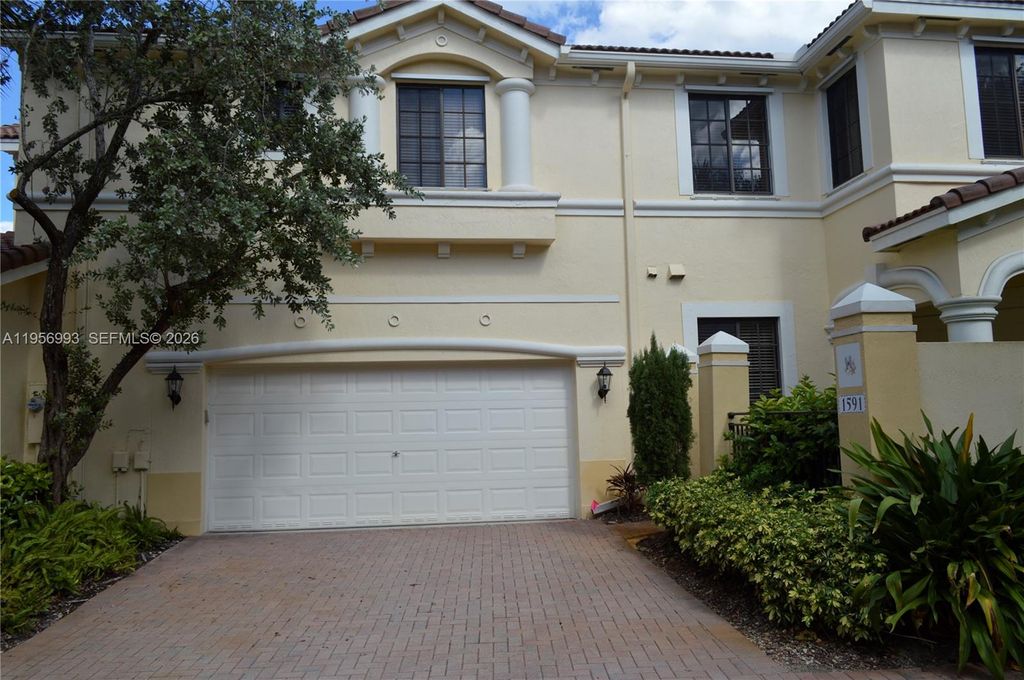 Photo of 1591 Passion Vine Cir #10-2, Weston, FL 33326 (MLS # A11956993)