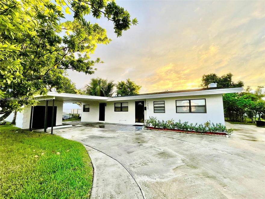 EXTRA LARGE & LOW taxes!! Spacious 3/2 in the heart of Miami Gardens. New roof 2025 and newer AC! New waterproof LVP floors and freshly painted. This home has a generous split floor plan spread out over 1,700sqft! With separate living and dining rooms AND a large family room that could be used as an office, den or playroom, you'll have all the room you need! Cozy up inside by the fireplace or enjoy a fully fenced backyard with mangos, avocados, plums and other tropical fruits. The extended driveway has a carport with a storage room and enough space for an RV or boat. Best of all - No HOA! Conventional, FHA and VA offers welcome! Come see and appreciate this home today - it could be yours!