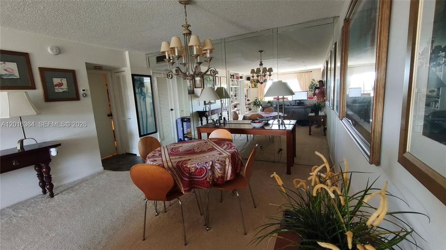 Beautiful large apartment with open dining and living room area. Spacious bed rooms with large closet space. Mint condition and fully furnished including a complete kitchen and ready to move in for a new owner. Designated parking spot right in front of the building entrance. Convenient to particular clean laundry room. Large balcony overlooking the golf course and pool area. The building was just recently painted and updated.  Located in gated community with separate access for residents and visitors to pass access control check point. Just minutes away from convenient shopping area with a wide variety of shops and grocery markets. Association requires min credit score and proof of annual income.