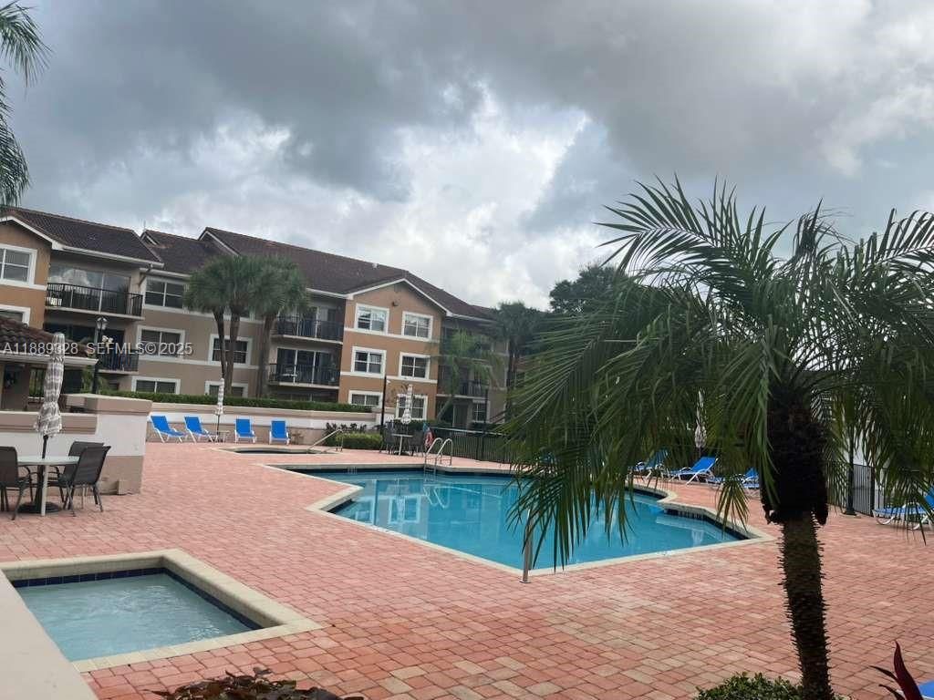 Photo of 8977 Wiles Rd #103, Coral Springs, FL 33067 (MLS # A11889328)