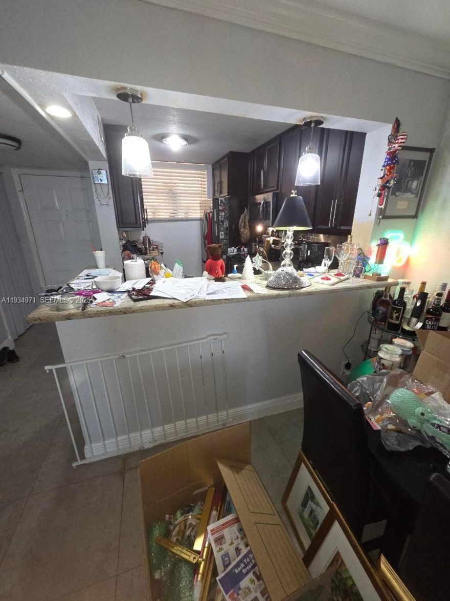 CURRENTLY ACCEPTING BACKUP OFFERS. Unapproved short sale – subject to lender approval. This condominium located at 112 Lake Emerald Drive, Apt 106, Oakland Park, FL 33309 has a standard layout with tile flooring throughout the unit. The property is being sold strictly as-is and will require general updating and repairs. Interior areas show signs of wear, including scuffed walls, dated finishes, and cluttered living spaces. The kitchen and bathrooms appear functional but are outdated and may need replacement or refurbishment. Ceiling and wall surfaces should be inspected and repaired as needed. The screened patio overlooks the lake but may require maintenance. Cash or hard money only—property will not qualify for conventional financing, and buyer is responsible for all due diligence, liens, code violations, and lender-required repairs. CALLS WILL NOT BE ANSWERED