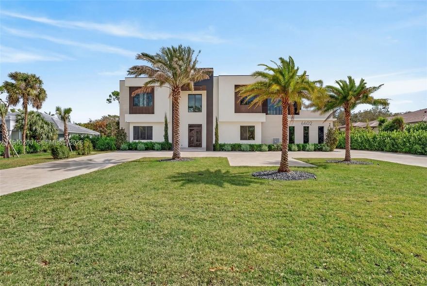 Welcome to this stunning new construction estate in the heart of Parkland! Boasting 6 bedrooms, 8 full bathrooms, and 1 half bath, plus an office/den. This luxurious residence offers an exceptional blend of elegance, functionality, and space. The home features boutique-style closets, a gourmet kitchen with quartz countertops, custom cabinetry, top-of-the-line appliances and 2 laundry rooms. Every bathroom is tastefully designed with high-end finishes. The expansive backyard is an entertainer’s dream, complete with a sparkling saline pool, jacuzzi, summer kitchen with barbecue area, and plenty of green space. Sitting on an oversized lot, there’s room to add a guest house, gym, or pickleball court. A rare opportunity to own a custom-built home!