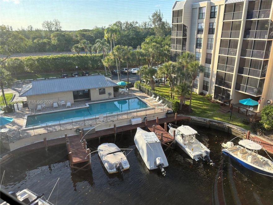 MOTIVATED SELLER — PRICED TO SELL! 

Bright and spacious 2-bedroom, 2-bath condo located in the desirable Boca Bayou community in the heart of East Boca Raton. This well-maintained unit features an open-concept layout, updated kitchen, and large windows throughout that fill the home with natural light. 

Enjoy relaxing on the screened balcony with beautiful canal and pool views. Both en-suite bedrooms are generously sized and offer excellent closet and storage space. Additional features include an in-unit washer and dryer (less than 1 year old), newer dishwasher and refrigerator, and tile flooring with laminate in the bedrooms.

Boca Bayou is a gated waterfront community offering 5 swimming pools, tennis courts, 24-hour manned security, and boat dockage rentals, with direct ocean access and views of the Hillsboro Canal/River. Conveniently located just minutes from the beach, Mizner Park, and Royal Palm Place.

Investor opportunity: Secure lease in place through August 2026 with current rent at $2,400/month. Potential to increase rental income, current tenant is willing to continue renting.