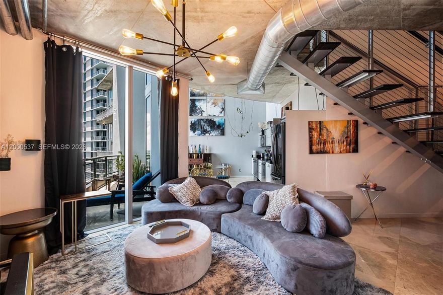 Oversized Duplex Penthouse Loft at Neo Vertika! Rarely available 2-story penthouse with 20-ft ceilings and floor-to-ceiling windows that bathe the space in natural light, creating an airy, open ambiance. Includes 2 full bathrooms, 3 closets, and parking for 2 cars. Bright and open layout with modern upgrades: black stainless steel appliances, Nest thermostat, motorized blinds, smart LED lighting, custom closet doors, and remodeled bathrooms. Amenities include infinity-edge pool, gym, spa, racquetball & basketball courts, sauna, 24/7 concierge, and more. Currently tenant-occupied and available by June 1st. Amazing opportunity to live in the most walkable and connected part of Brickell — steps from Brickell City Centre, close to everything yet tucked along the peaceful Miami River!