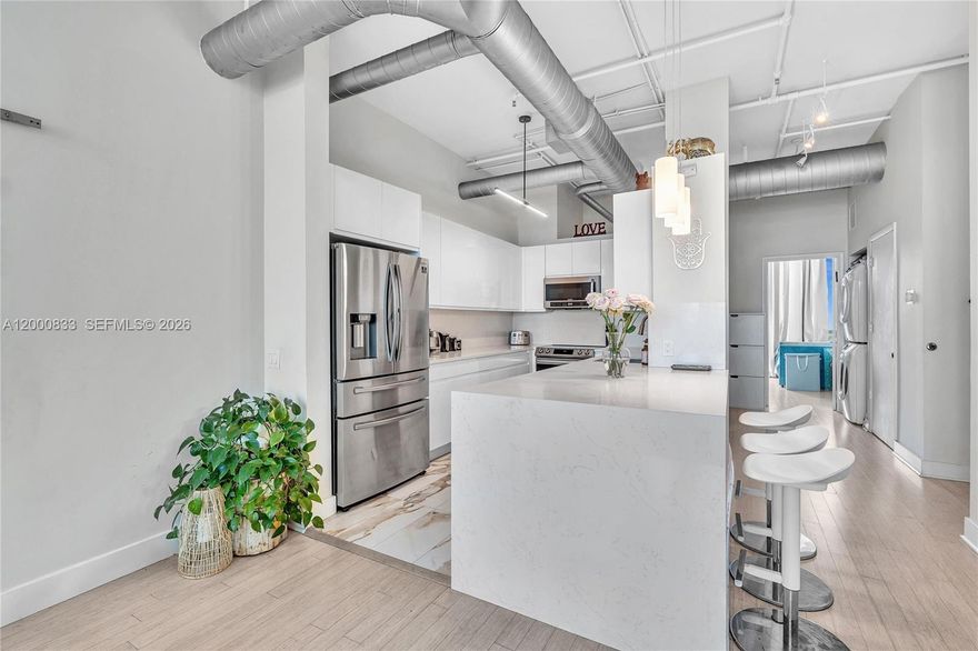 Beautiful 3-bedroom, 2-bath residence at Uptown Marina Lofts . This spacious unit features a modern renovated kitchen with waterfall countertops and stainless steel appliances, perfect for both everyday living and entertaining.
Enjoy bamboo flooring throughout and a stylishly updated primary bathroom featuring a floating vanity, floor-to-ceiling tile, and a sleek glass shower. The highlight of the home is the stunning marina view, offering a peaceful waterfront backdrop from the living space.
The building offers resort-style amenities including a fitness center, tennis and basketball courts, sauna, steam room, yoga and massage rooms, pool, and jacuzzi. Ideally located just steps from parks, top-rated schools, golf courses, shopping, and dining, this residence combines modern design, resort-style comfort, and beautiful water views in the heart of Aventura