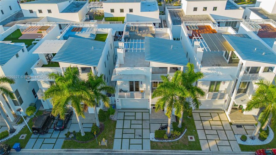 Live in luxury at Oasis at Doral, an exclusive gated community. Stunning 4-bed, 4.5-bath single-family home with 3,448 sqft of modern design. Features porcelain floors on the first level, wood floors upstairs, and a guest suite with full bath on the main floor. Open Italian kitchen with quartz countertops, premium appliances, and a stylish wine cellar. The primary suite offers custom closets and a spa-inspired bathroom. Enjoy a private pool and rooftop terrace with jacuzzi. Community includes 24-hr security, clubhouse, gym, kids’ area, and pool. Close to CityPlace Doral, top schools, shops, and highways.